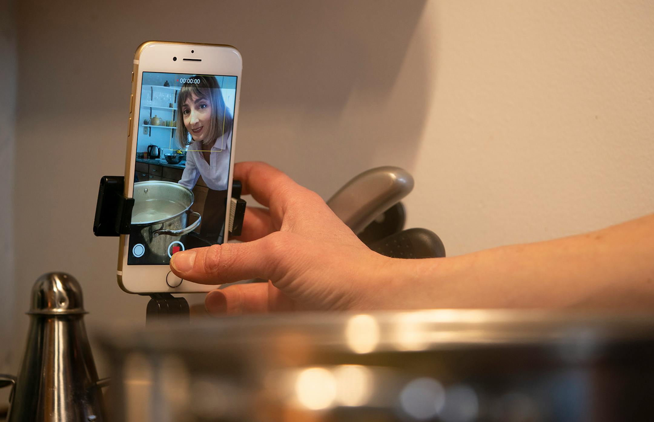 Chef Karyn Tomlinson got ready to press record while showing how to make two soups on her Instagram show. Since the pandemic began, former Corner Table chef Karyn Tomlinson has been a prolific poster to Instagram, offering free cooking lessons with her show "Karyn's Quarantine Kitchen." She was photographed producing a segment on preparing pureed soups Thursday afternoon, April 23, 2020 in the kitchen of her condo.