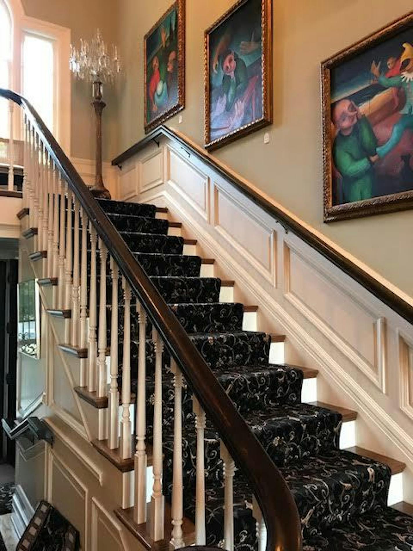 Staircase and artwork in Irwin Jacobs estate