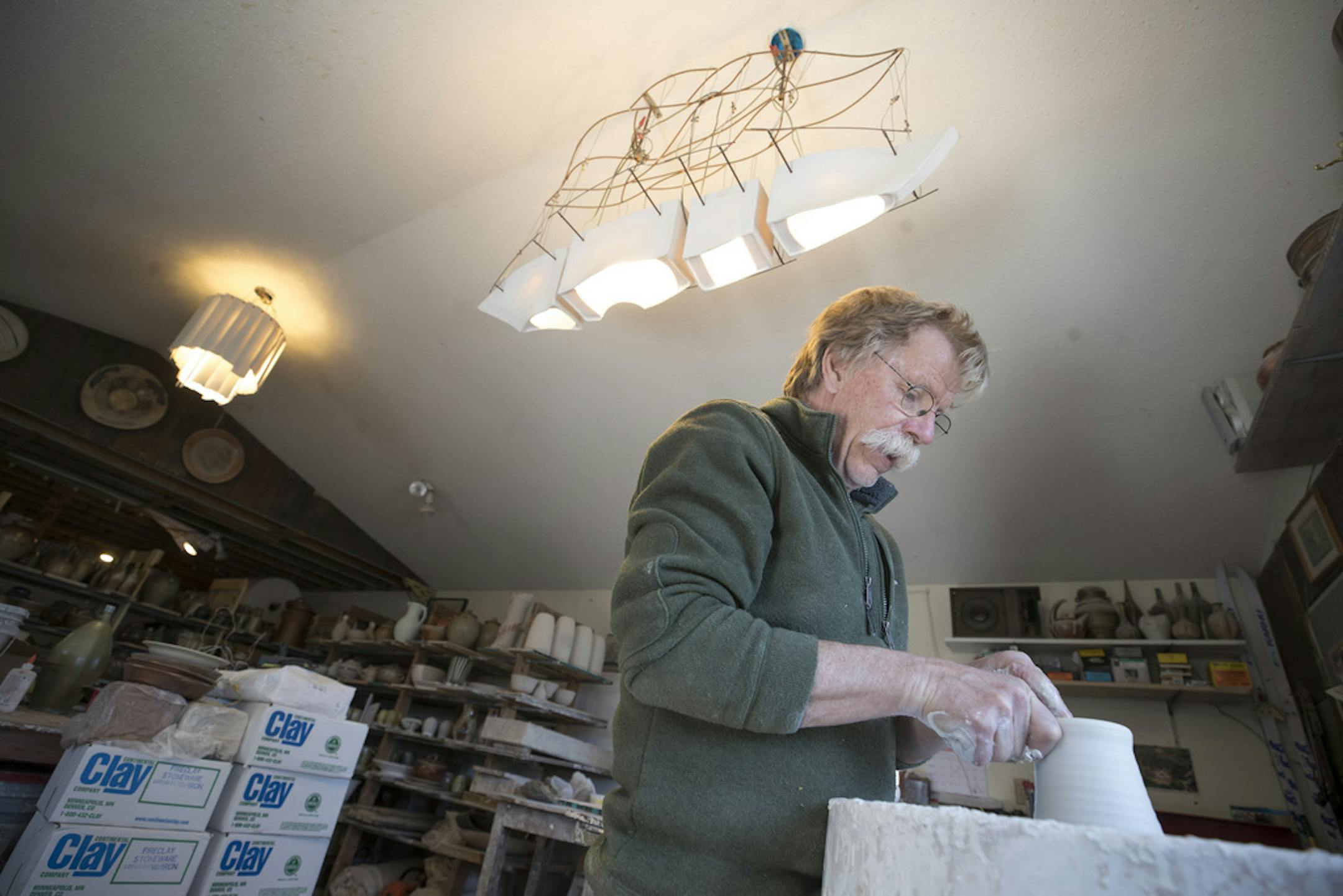 Bill Gossman worked at his pottery studio in New London in 2018.