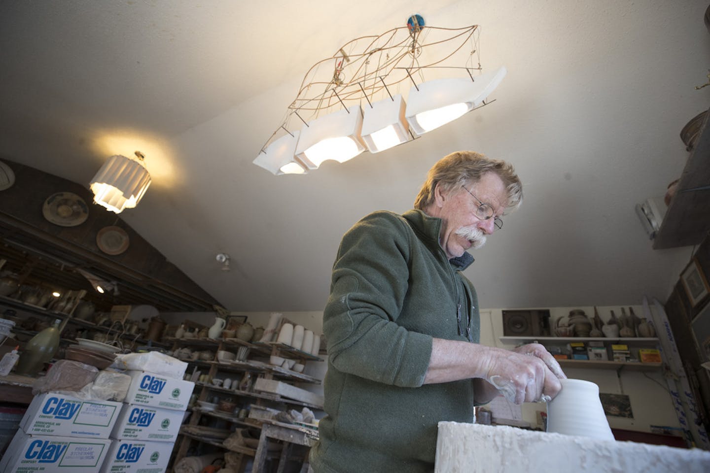 Bill Gossman worked at his pottery studio in New London in 2018.