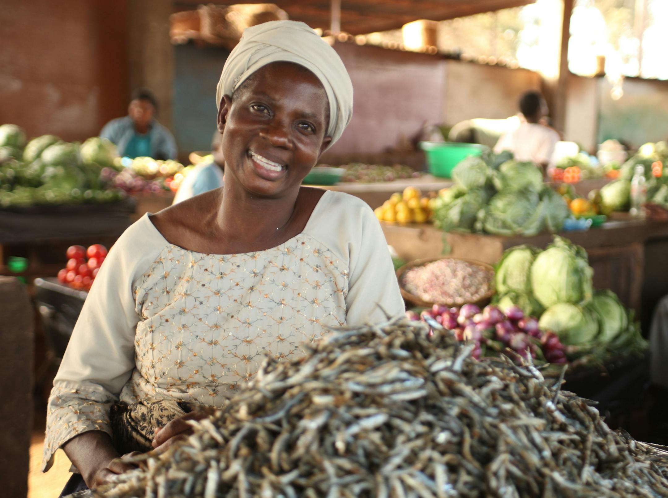 Opportunity International client Teleza Chisi, a widow and mother, operates a fish sale-and-catering business in Malawi, Africa. She is one of 9.6 million savings-and-microloan business clients around the world financed by supporters of Opportunity International.