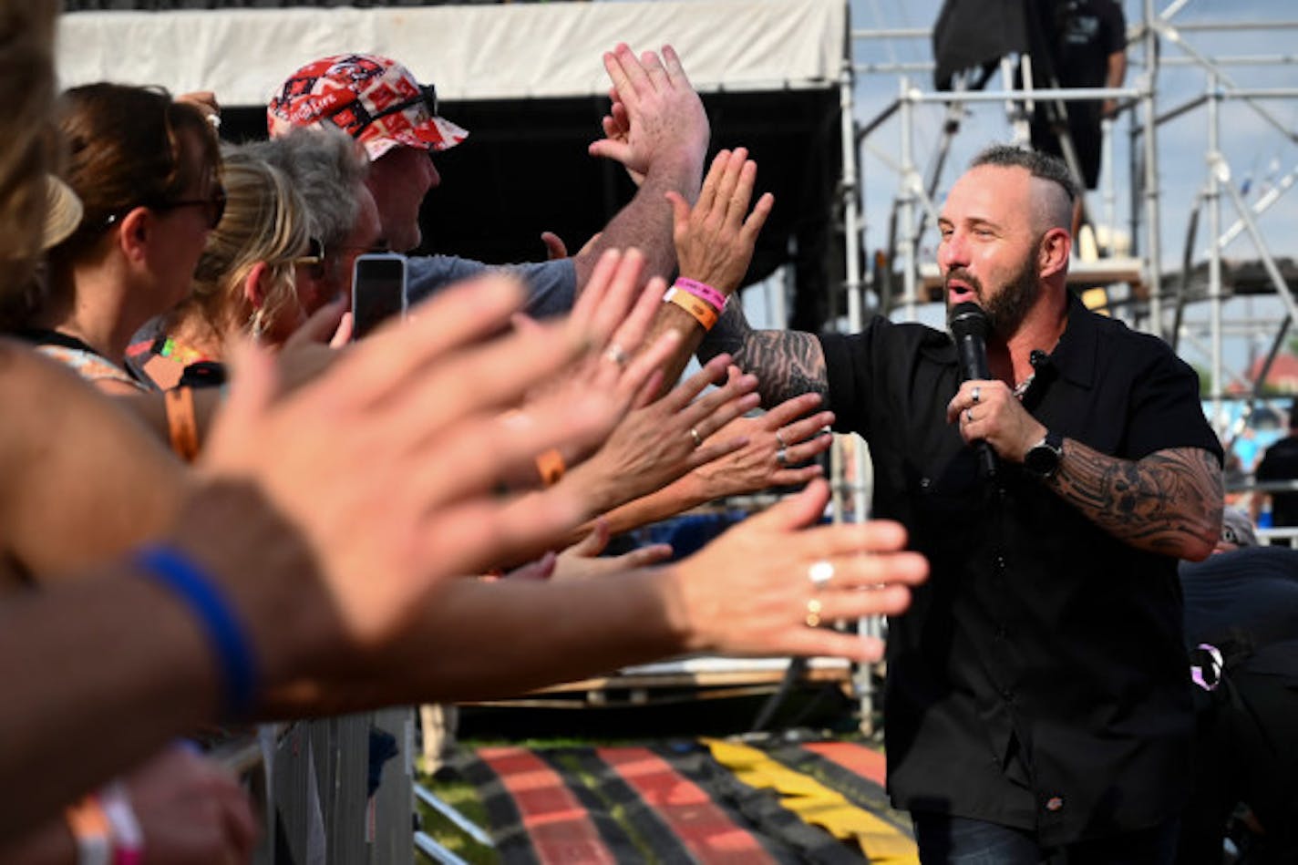 KFAN's Chris Hawkey rocking in pre-COVID times/ Star Tribune photo by Aaron Lavinsky