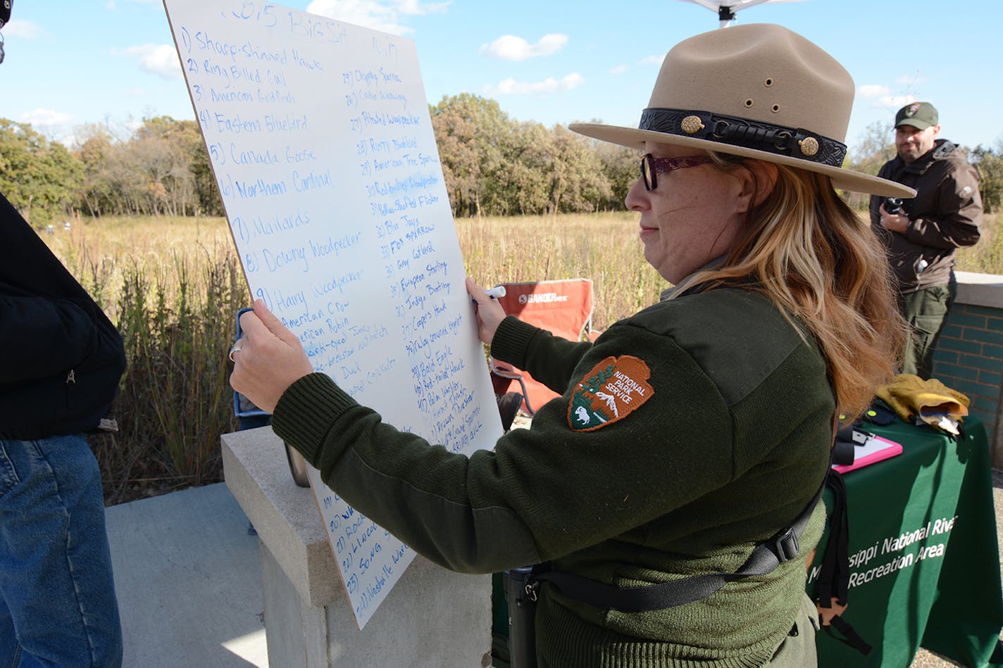 Ranger Sharon Stiteler of the Mississippi River & Recreation Area park looks at a list of birds sighted during the Big Sit on Oct. 17.