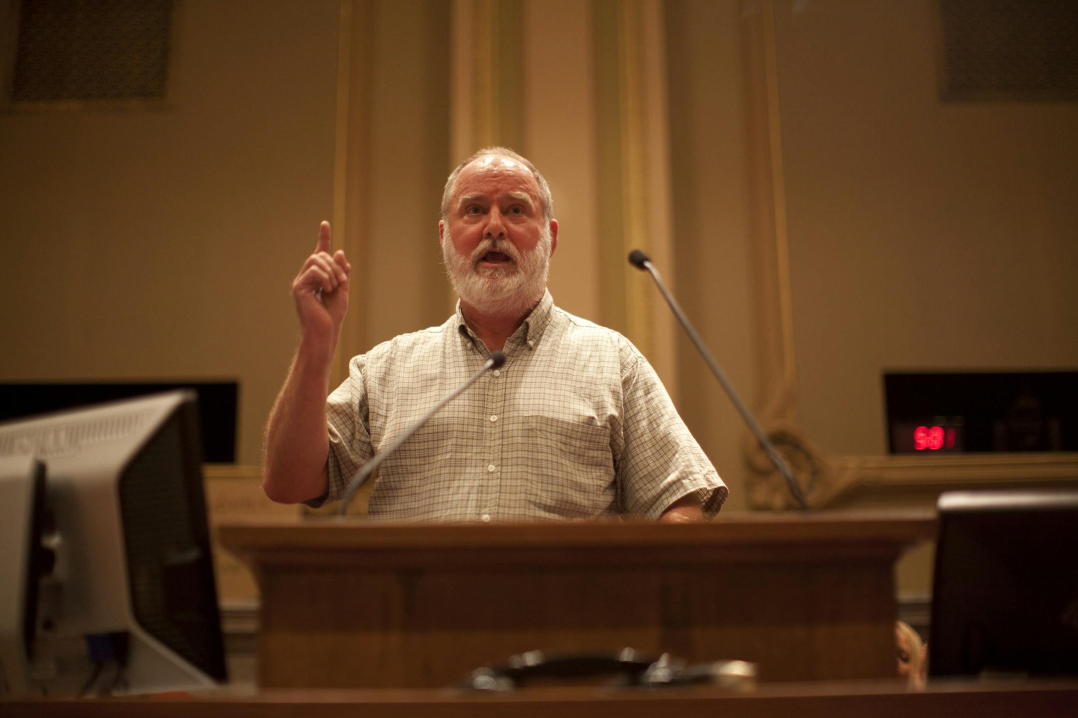 Retired teacher Charlie Underwood of Minneapolis spoke against a Vikings stadium plan during a hearing Tuesday at City Hall.