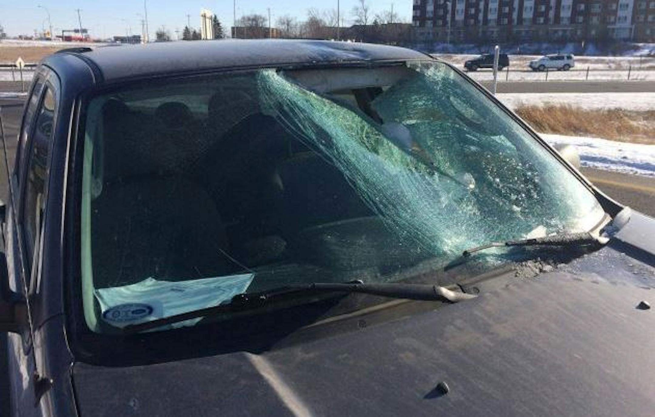 A chunk of ice flew free from a semitrailer truck humming along Hwy. 36 Roseville, smacked into an SUV windshield and injured the trailing driver, authorities said Wednesday.