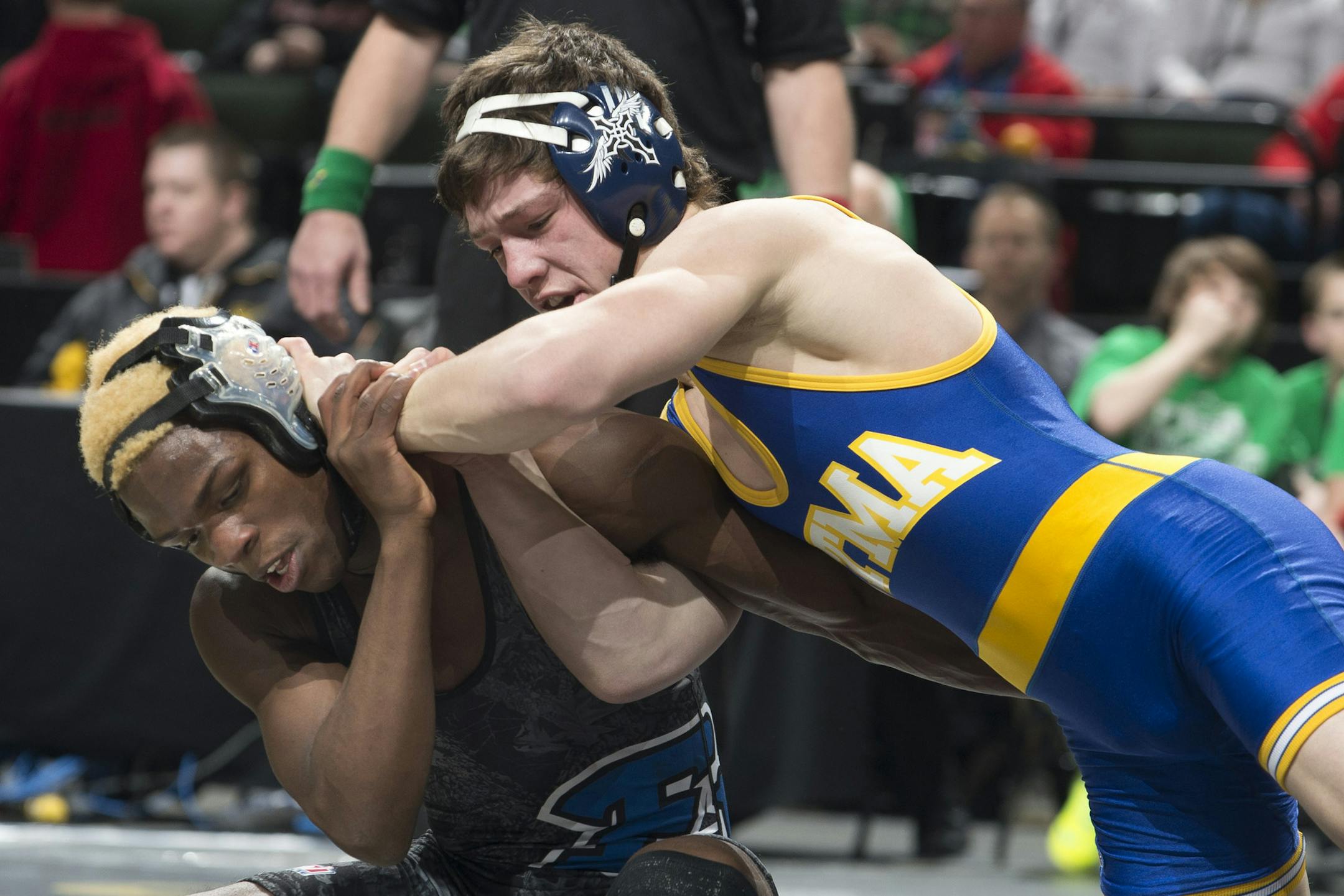 Mitchell McKee, right, St. Michael-Albertville tries to get a hold on George Farmah, of Eastview, in the Class 3A 126 lb. Championship on Saturday. ] (Aaron Lavinsky | StarTribune) Wrestlers compete in the State Wrestling Tournament on Saturday, Feb. 28, 2015 at Xcel Energy Center in St. Paul.