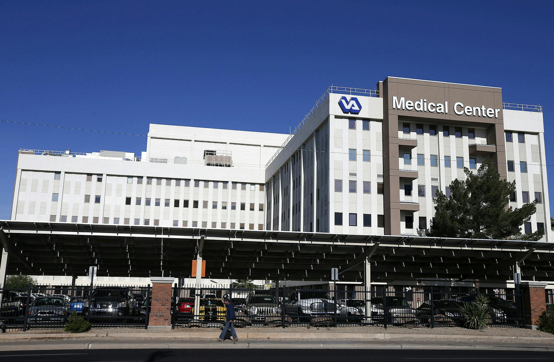 This photo taken April 28, 2014 shows the Phoenix VA Health Care Center in Phoenix. Veterans at the Phoenix veterans hospital waited on average 115 days for their first medical appointment _ 91 days longer than the hospital reported, the Veterans Affairs Department&#x201a;&#xc4;&#xf4;s inspector general said Wednesday. Rep. Jeff Miller, R-Fla., chairman of the House Veterans Affairs Committee, and Sen. John McCain, R-Ariz., immediately called for VA Secretary Eric Shinseki to resign. Miller also