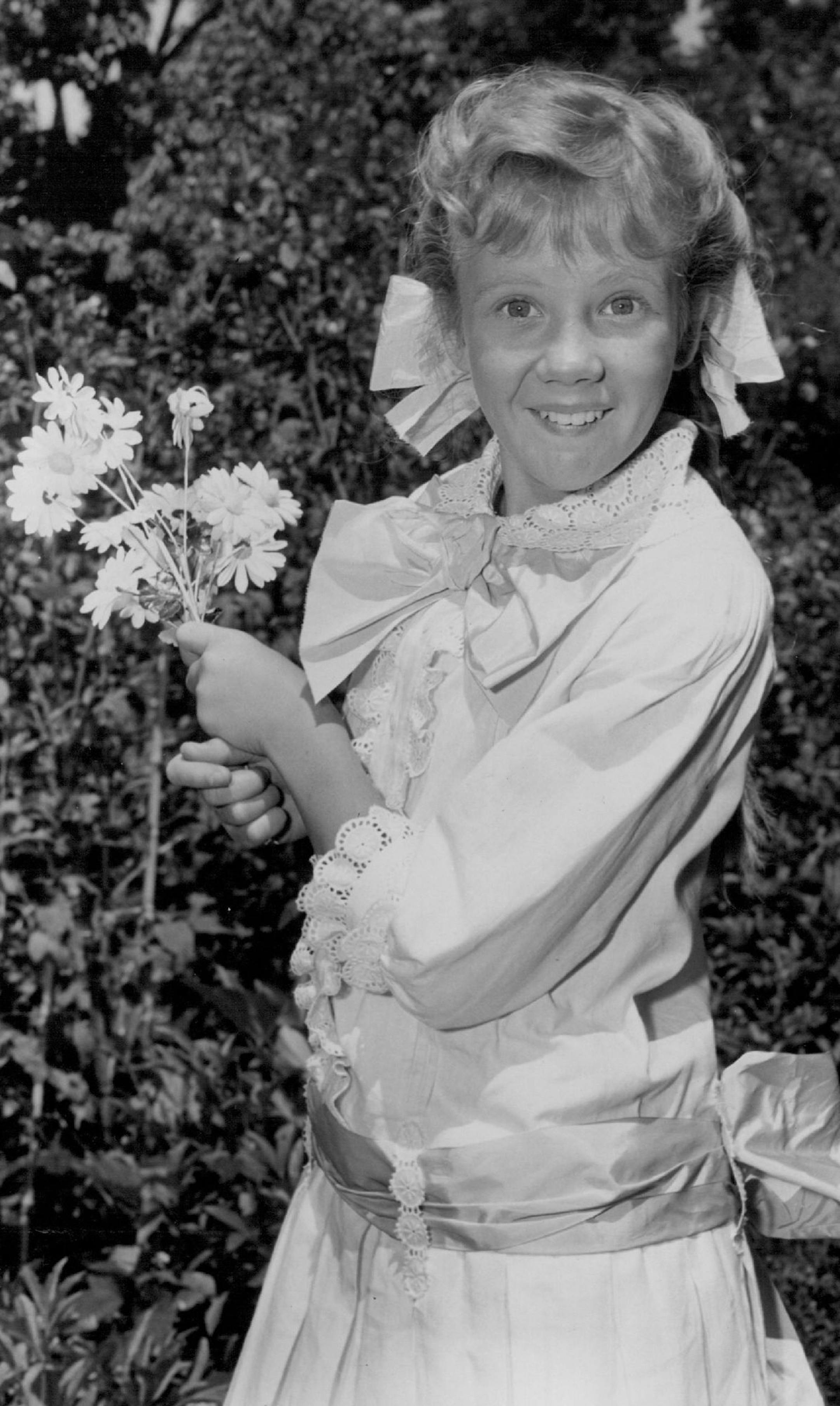 February 23, 1987 Hayley Mills, 13-year-old daughter of English actor, John E Mills, as "Pollyanna" in Walt Disney's high-budget, Technicolor production of the famed Eleanor H. Porter perennial best-seller. E E "Pollyanna" is young Miss Mills first American motion a 04picture production, and the second film she has ever made. Her w -Fri first appearance in a motion picture is in the currently running British production, "Tiger Bay," for which she won the Silver Award at this year's Berlin Film F