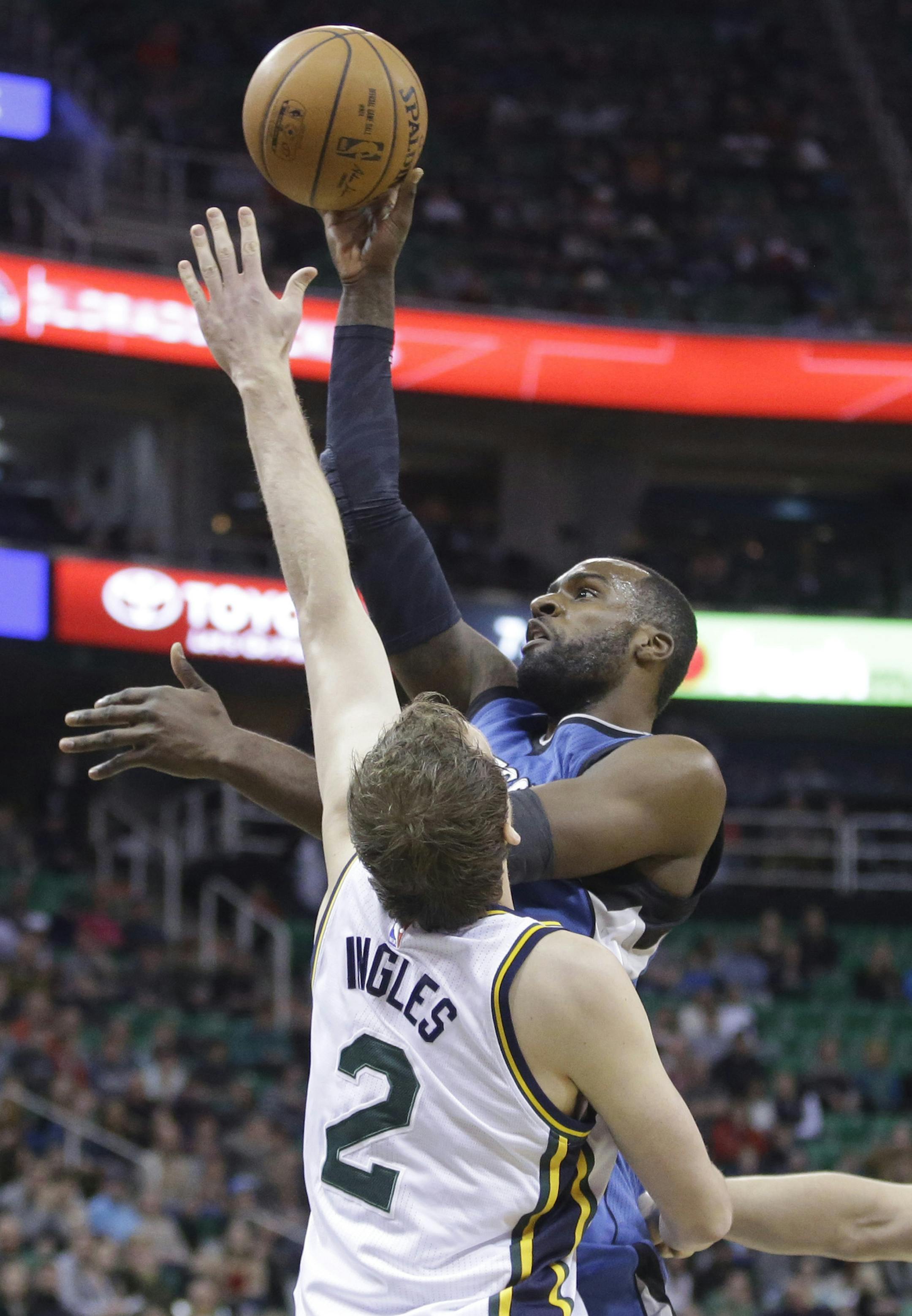Wolves forward Shabazz Muhammad took a shot over Utah forward Joe Ingles in the opening quarter.