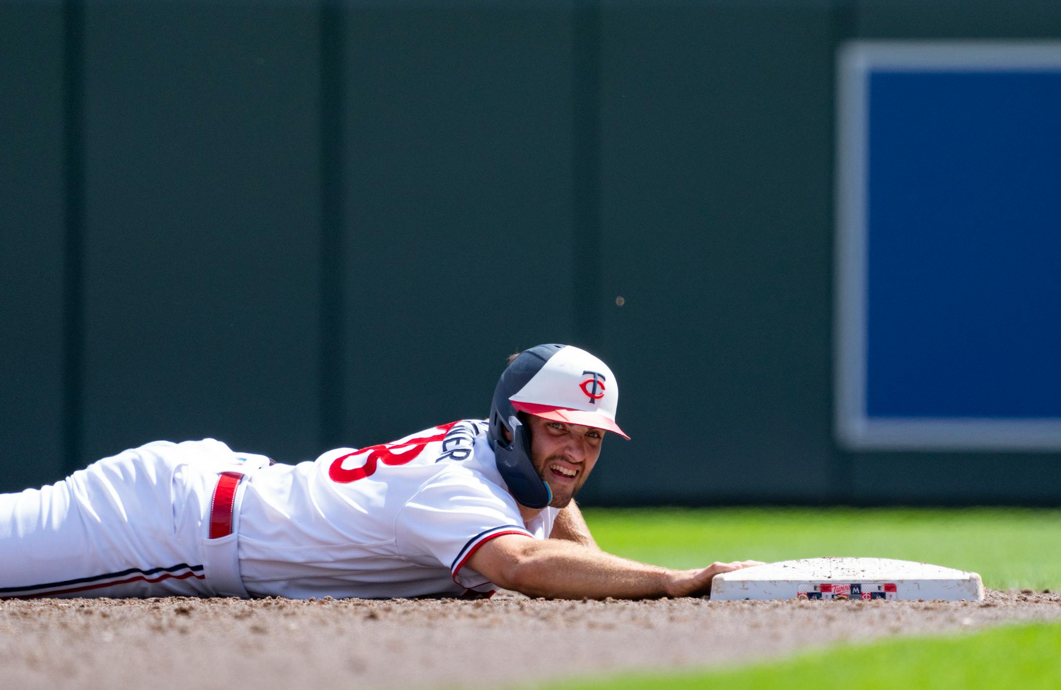 Minnesota Twins left fielder Matt Wallner (38) holds onto the bag after sliding into second base against the Detroit Tigers in the third inning.