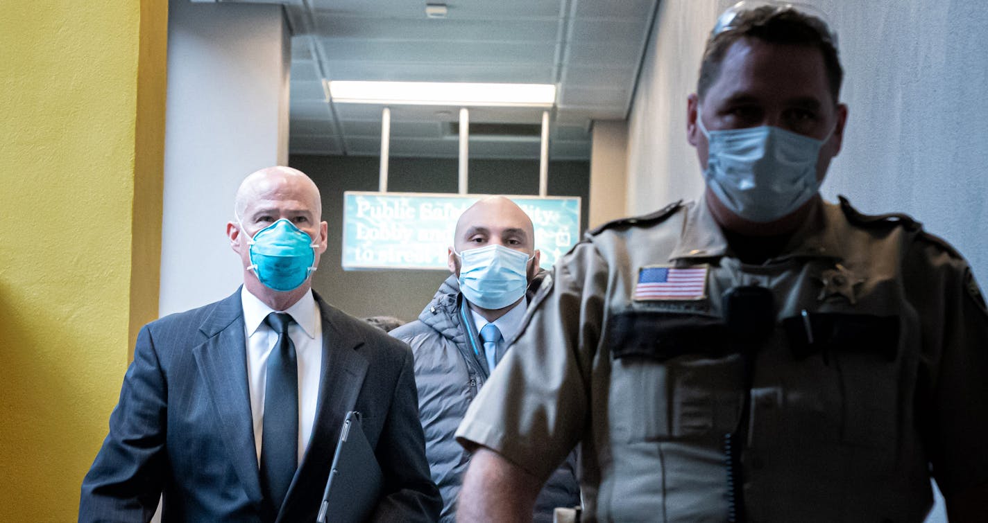 Former Minneapolis police officer J. Alexander Kueng, center, walked out of the Hennepin County Public Safety Facility Monday afternoon with his attorney Thomas Plunkett. ] GLEN STUBBE • glen.stubbe@startribune.com Monday, June 29, 2020 All four former officers charged in the killing of George Floyd will appear in court one-at-a-time Monday starting at 12:15 p.m. Derek Chauvin will appear remotely via remote TV. Two of his former colleagues, J. Alexander Kueng and Thomas Lane, have posted bond s