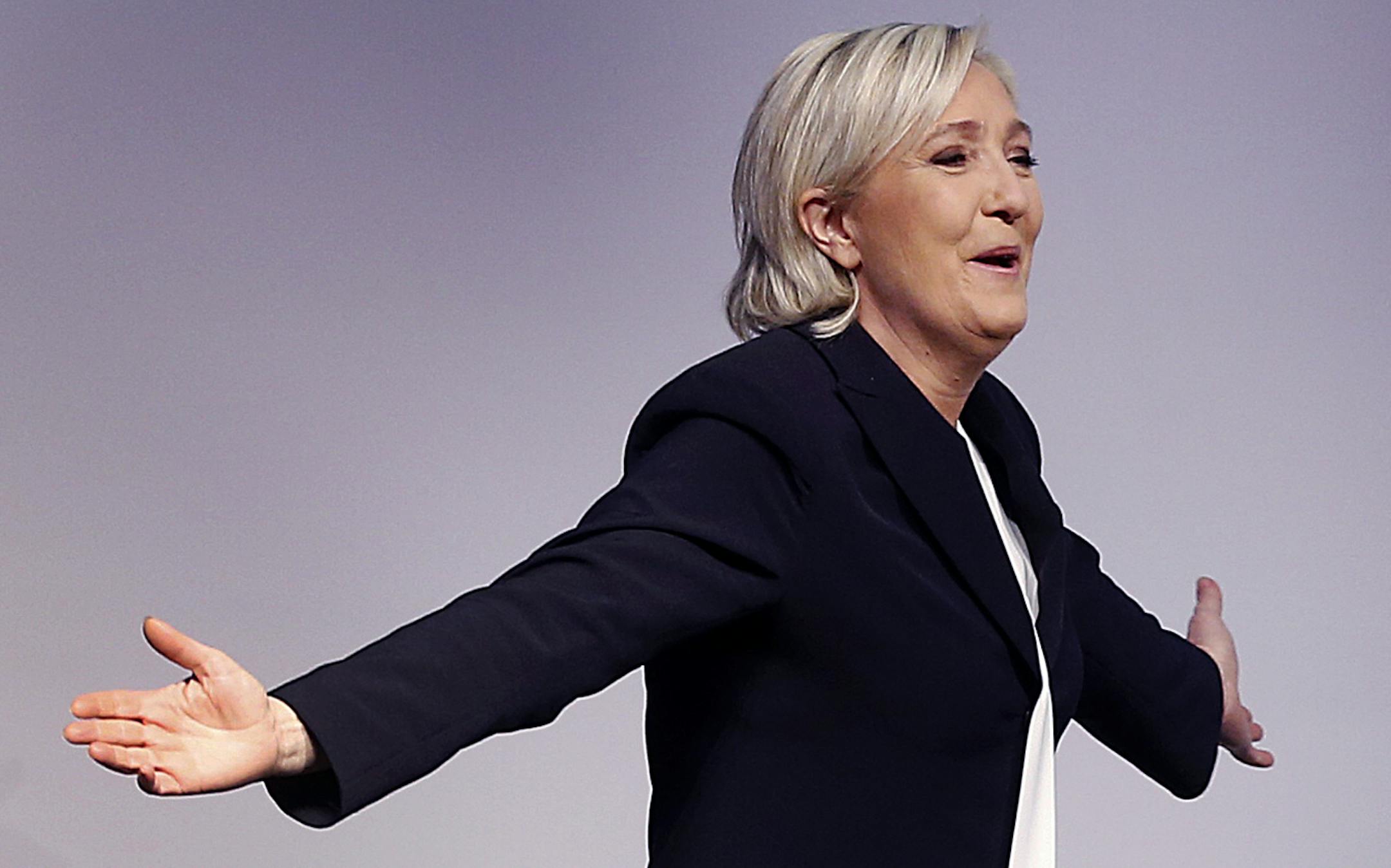 Far-right leader and candidate for next spring presidential elections Marine le Pen from France celebrates after her speech at a meeting of European Nationalists in Koblenz, Germany, Saturday, Jan. 21, 2017. (AP Photo/Michael Probst)