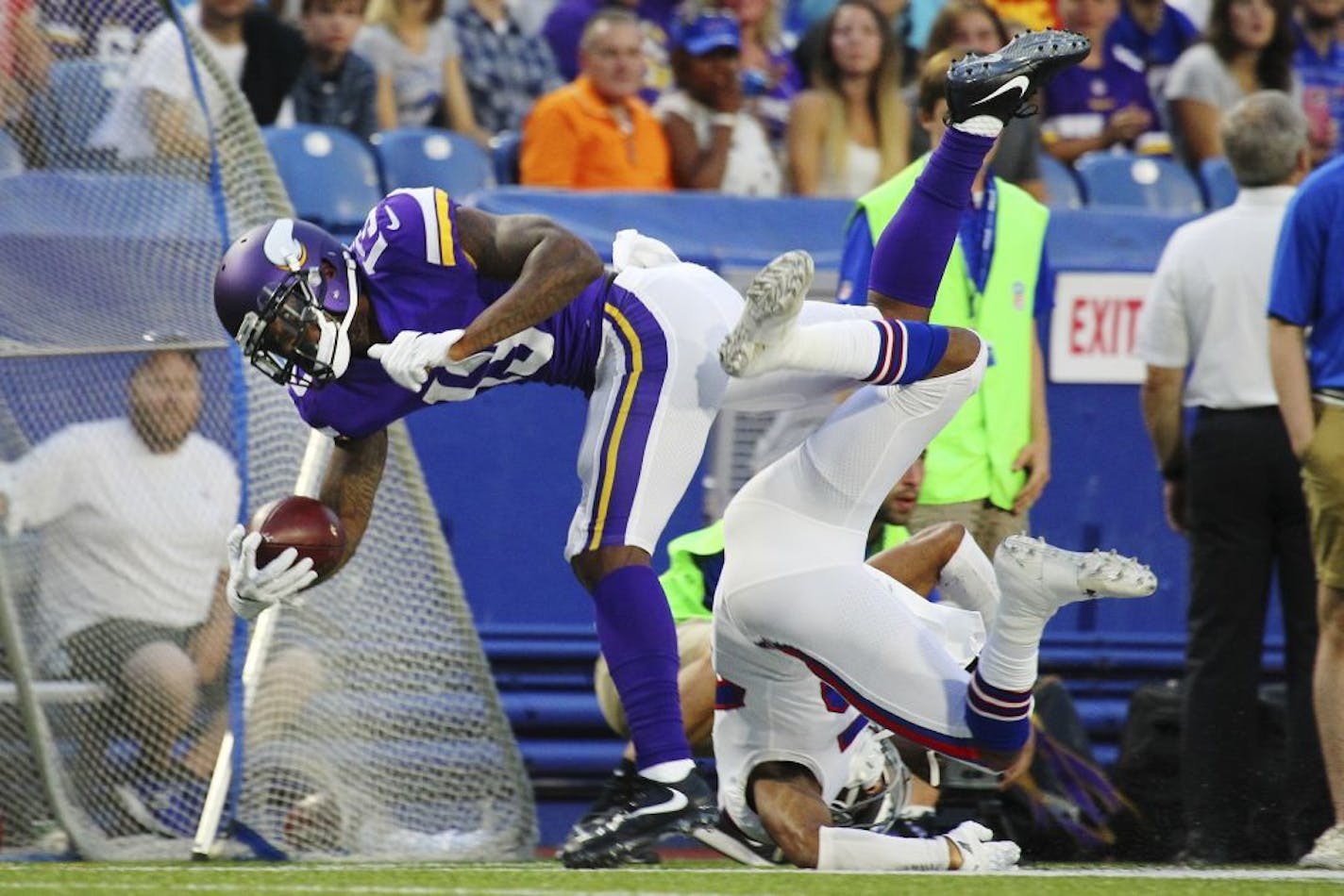 Minnesota Vikings wide receiver Stacy Coley (13) leaps over Buffalo Bills cornerback Marcus Sayles (45) during the first half of a preseason NFL football game Thursday, Aug. 10, 2017, in Orchard Park, N.Y.