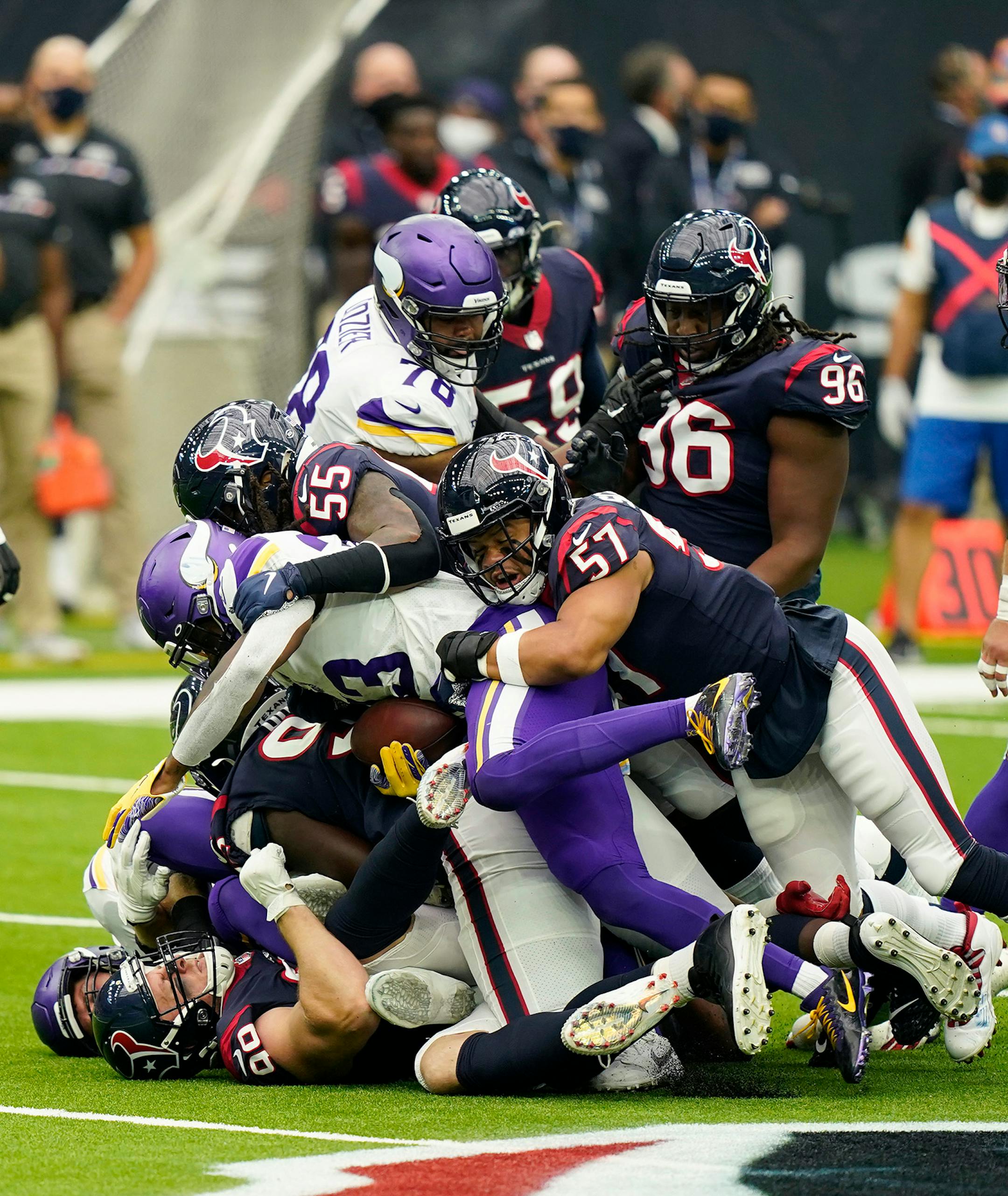 Minnesota Vikings running back Dalvin Cook (33) is wrapped up during the first half ofan NFL football game against the Houston Texans, Sunday, Oct. 4, 2020, in Houston. (AP Photo/David J. Phillip)