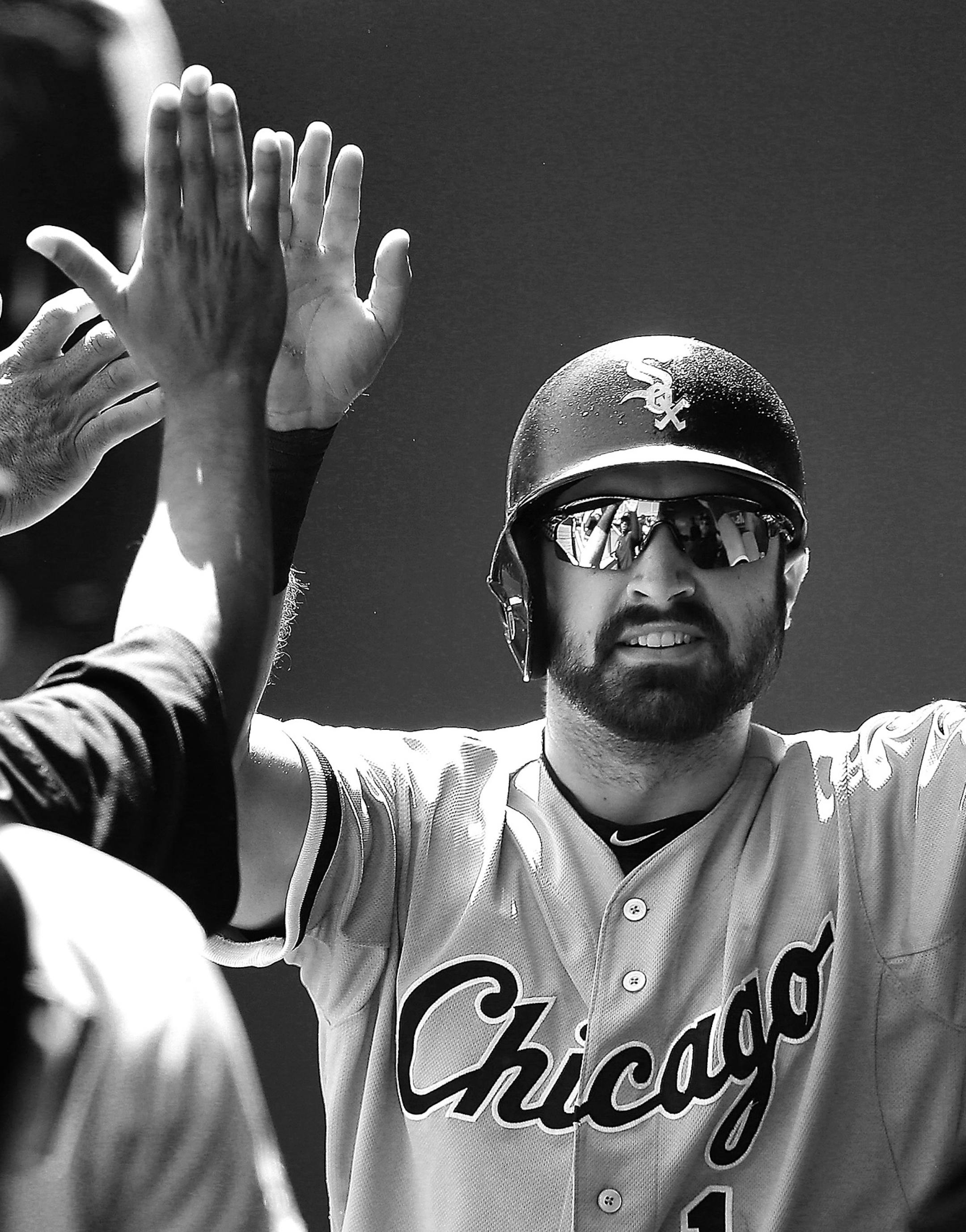 Chicago White Sox's Adam Eaton celebrates in the dugout after scoring on a single by Jose Abreu during the first inning of a baseball game against the Kansas City Royals, Sunday, Sept. 6, 2015, in Kansas City, Mo. (AP Photo/Charlie Riedel)