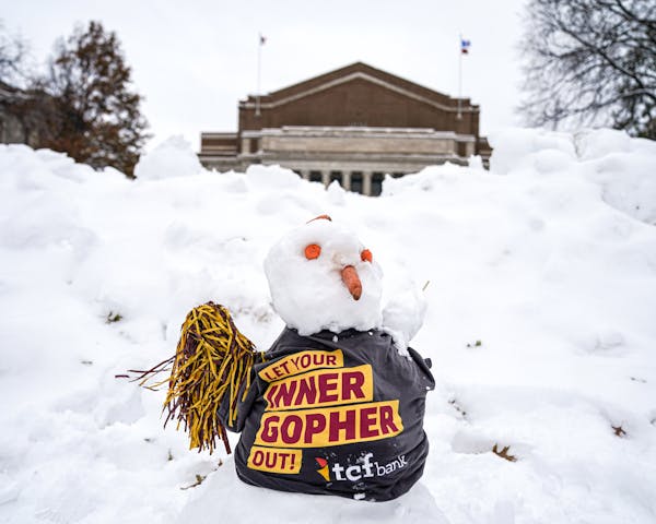 A fresh snowman sat on Northrop Mall as nearby crews assembled the stage Wednesday afternoon in preparation for ESPN's "College GameDay."