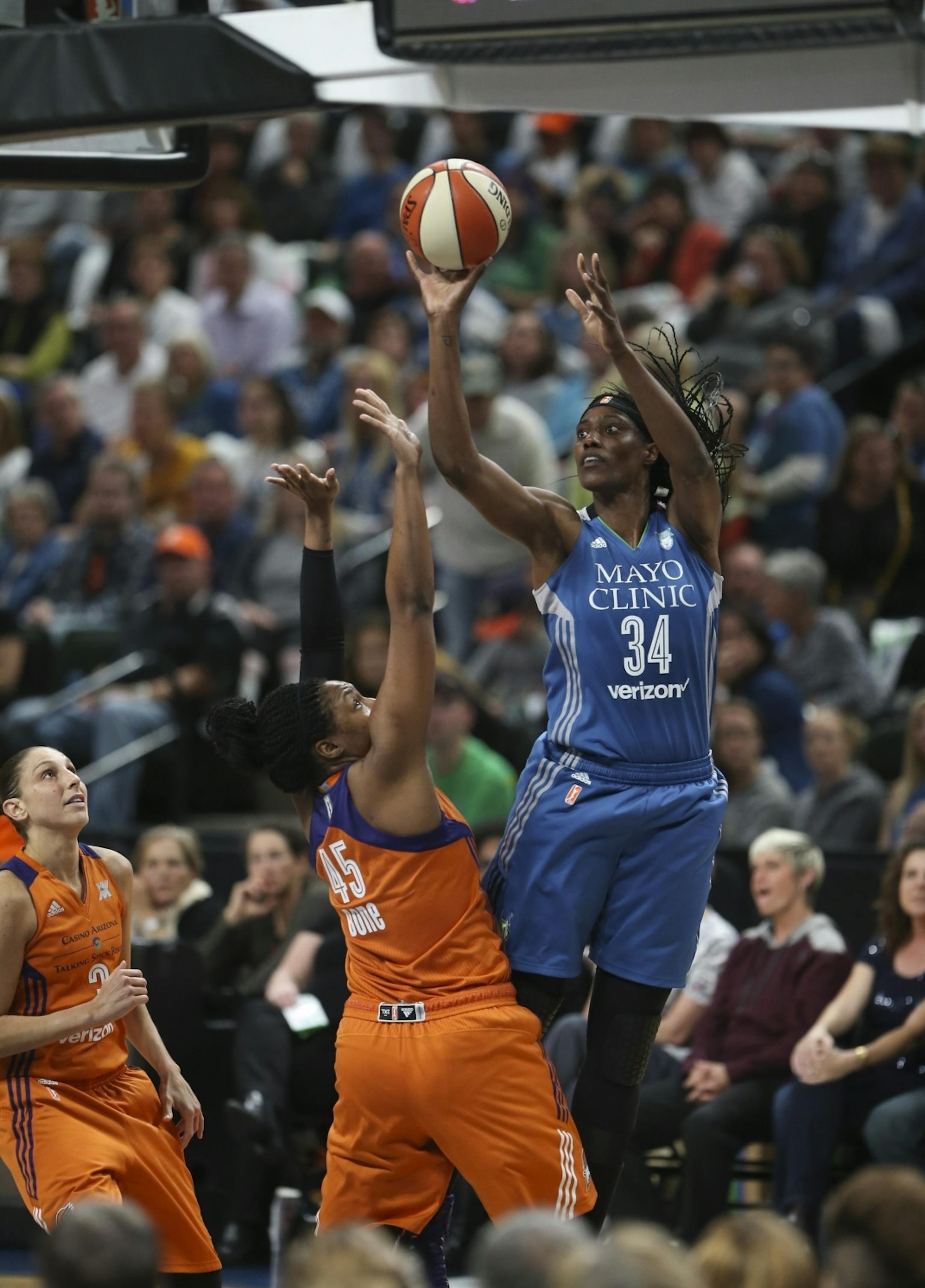 Minnesota Lynx center Sylvia Fowles (34) shot over Phoenix Mercury center Kelsey Bone (45) in the second quarter.