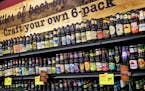 The Cub Foods liquor store features a tasting bar and a craft your own beer six-pack wall.
