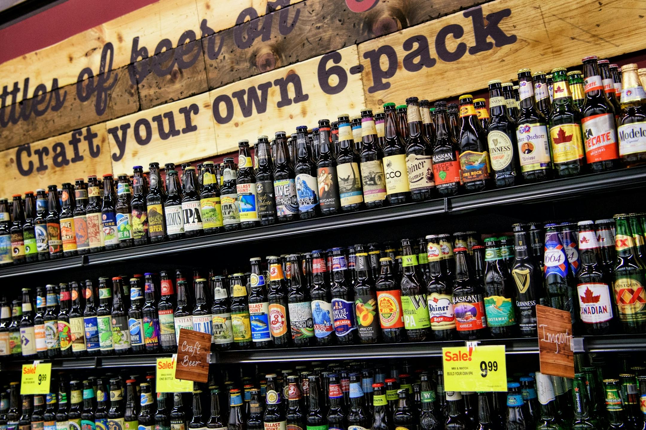 The Cub Foods liquor store features a tasting bar and a craft your own beer six-pack wall.