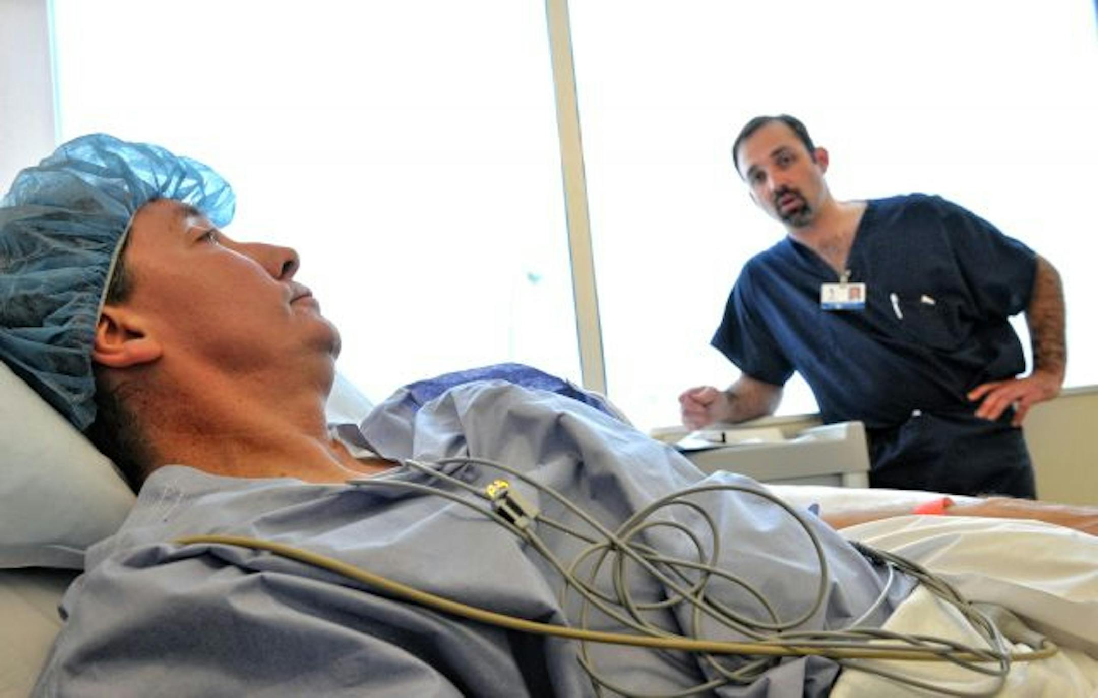 Dr. Jonathan Braman, right, talked with Jeffrey Scott.
