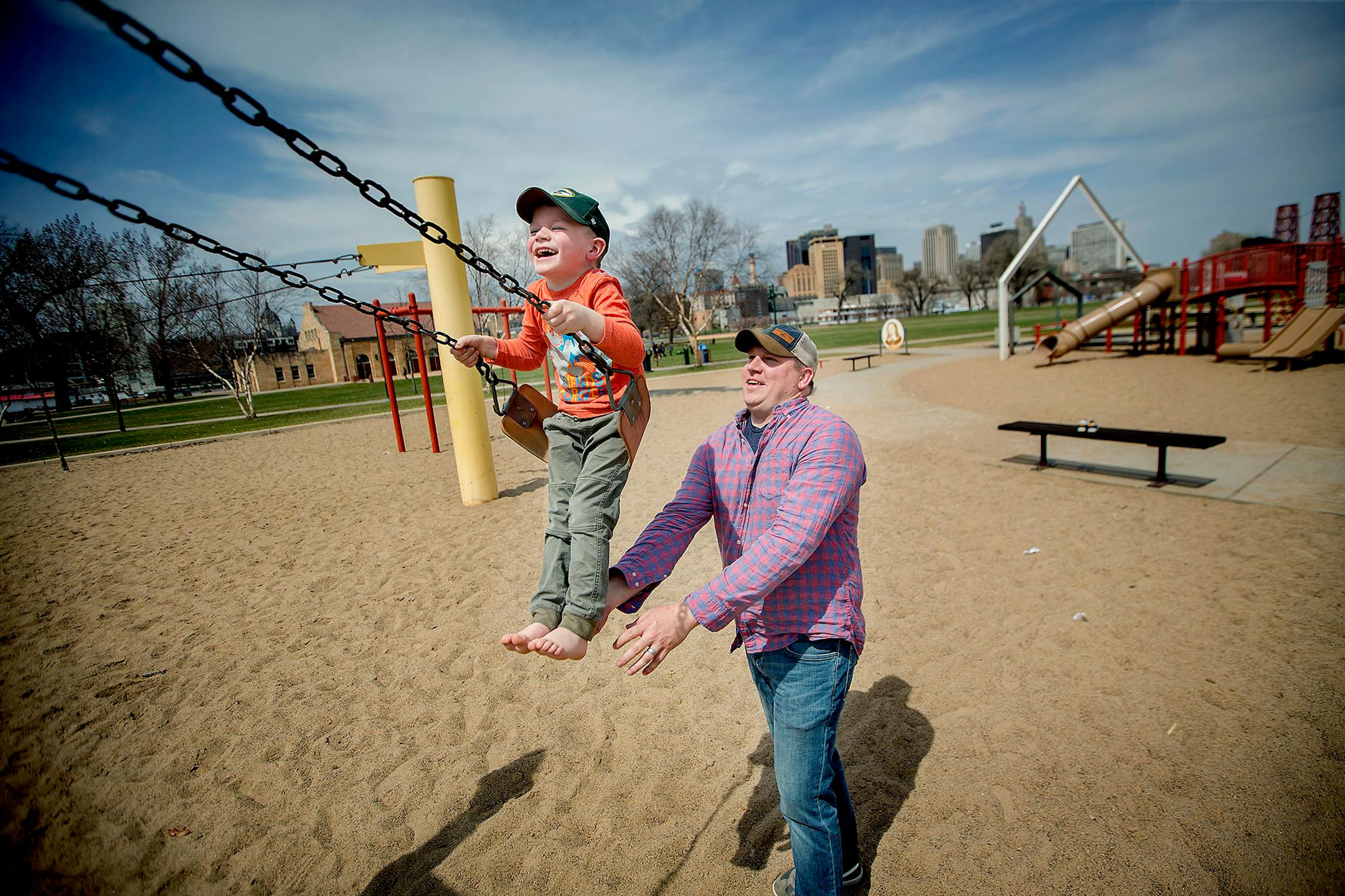 Four-year-old Aiden Giefer was happy to swing in the sun Monday with his dad, Joel Giefer, at Harriet Island Park in St. Paul.