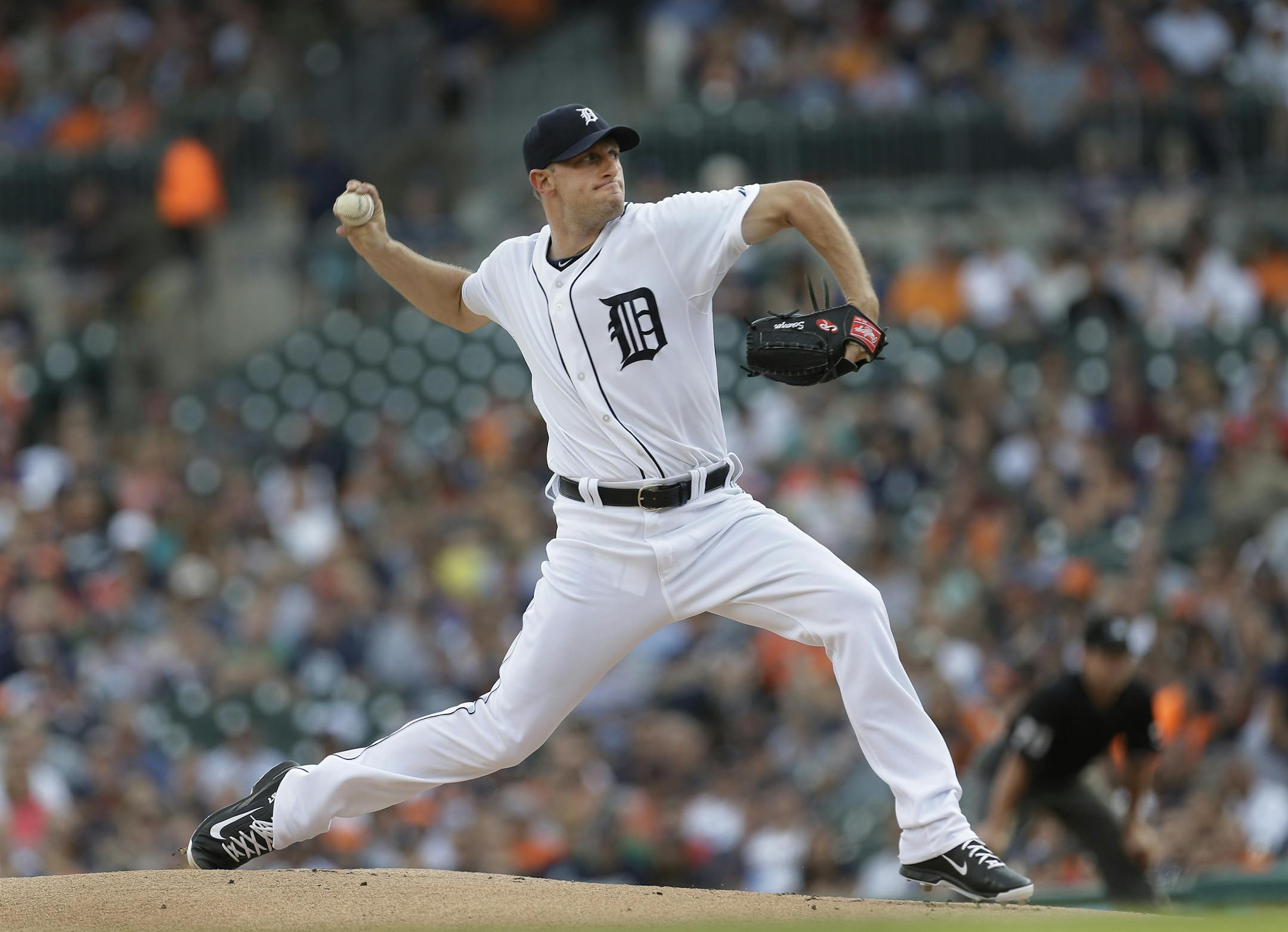 Detroit Tigers pitcher Max Scherzer throws against the Kansas City Royals in the first inning of a baseball game in Detroit, Tuesday, June 17, 2014. (AP Photo/Paul Sancya) ORG XMIT: MIPS101