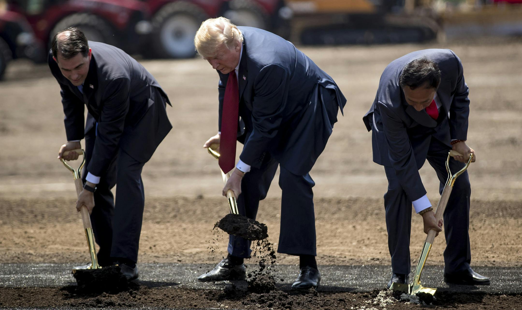 From left, Wisconsin Gov. Scott Walker, President Donald Trump and Foxconn chairman Terry Gou at a groundbreaking for the Foxconn plant Thursday, June 28, 2018 in Mt. Pleasant, Wis. (Brian Cassella/Chicago Tribune/TNS) ORG XMIT: 1500071