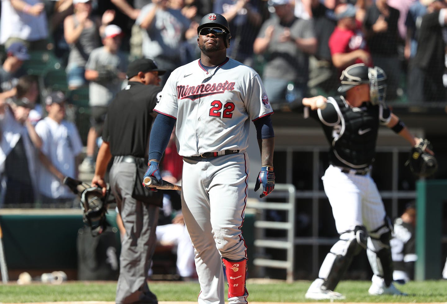 The Minnesota Twins' Miguel Sano (22) heads to the dugout after striking out with the bases loaded to end the top of the seventh inning against the Chicago White Sox at Guaranteed Rate Field on Thursday, July 1, 2021, in Chicago. (John J. Kim/Chicago Tribune/TNS) ORG XMIT: 20495970W