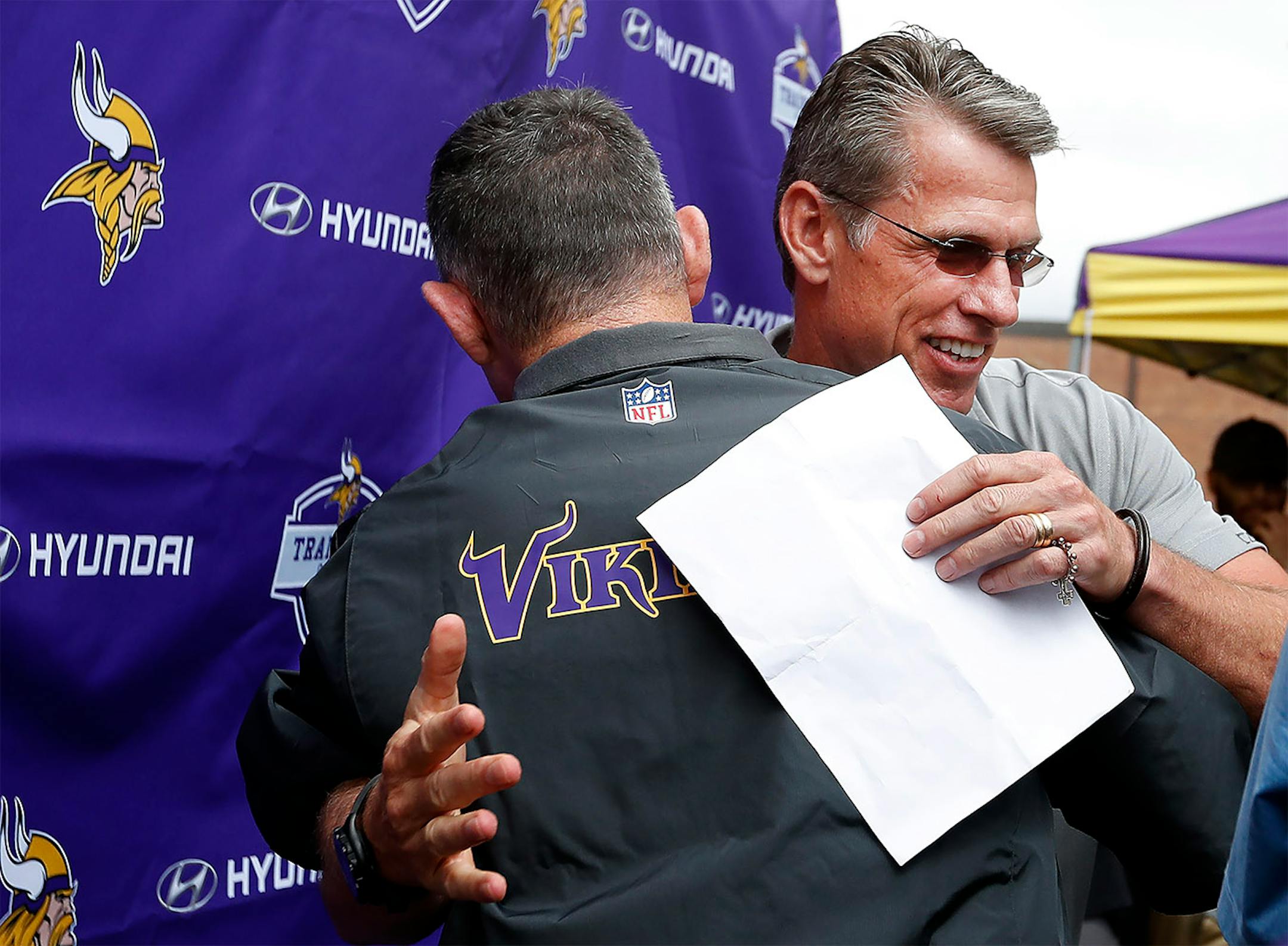 Minnesota Vikings head coach Mike Zimmer got a hug from general manager Rick Spielman after it was announced that Zimmer received a contract extension.
