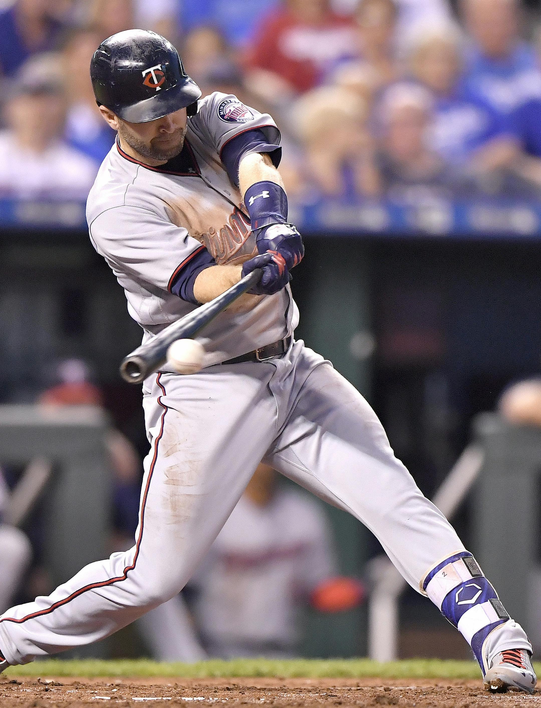 The Minnesota Twins' Brian Dozier connects on an RBI single in the second inning against the Kansas City Royals at Kauffman Stadium in Kansas City, Mo., on Friday, Sept. 8, 2017. (John Sleezer/Kansas City Star/TNS) ORG XMIT: 1210710