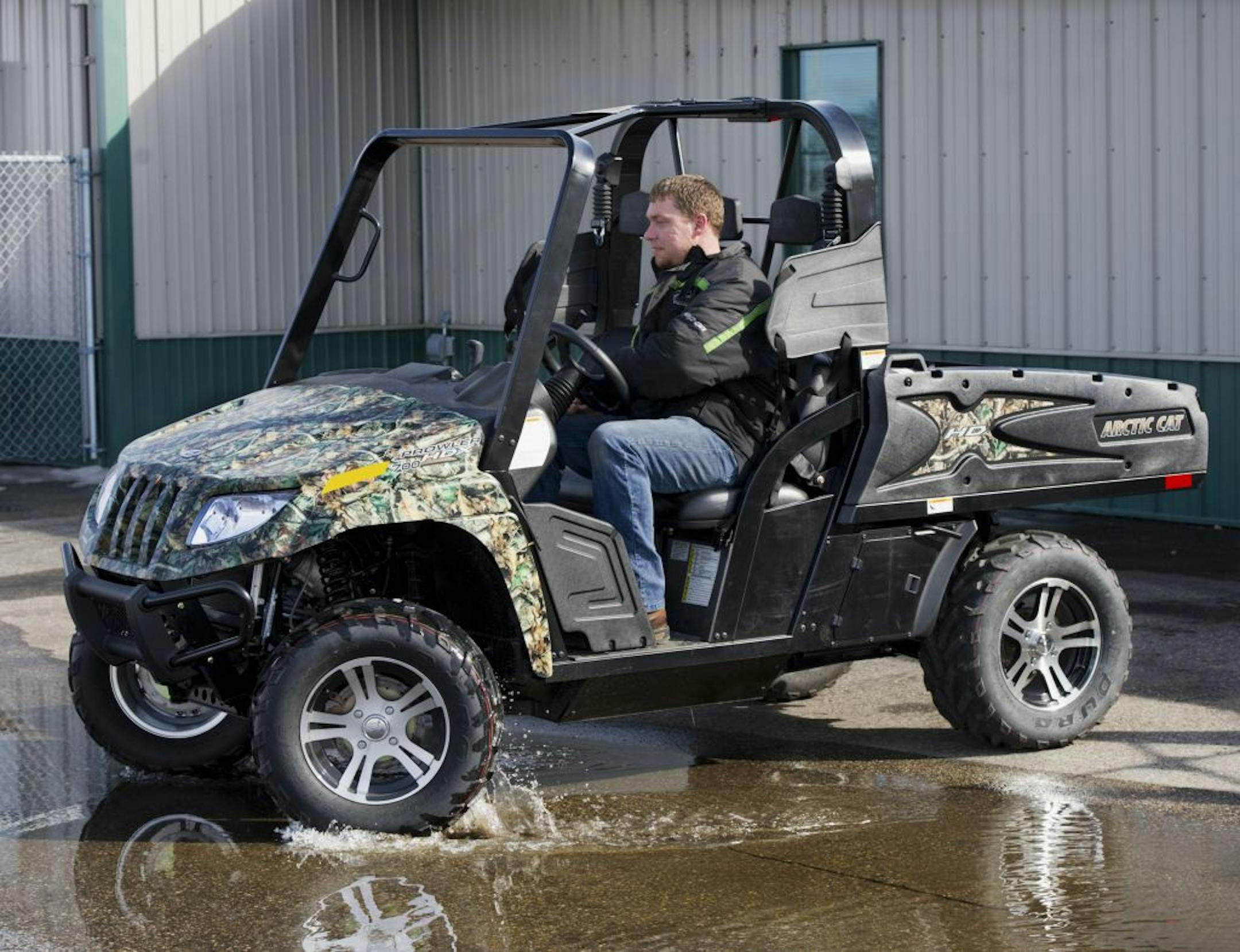 Josh Matejcek, a service manager at Settee Sports Center in Owatonna, Minn., on an Arctic Cat Prowler HDX side-by-side ATV.
DavID Brewster • Star Tribune file