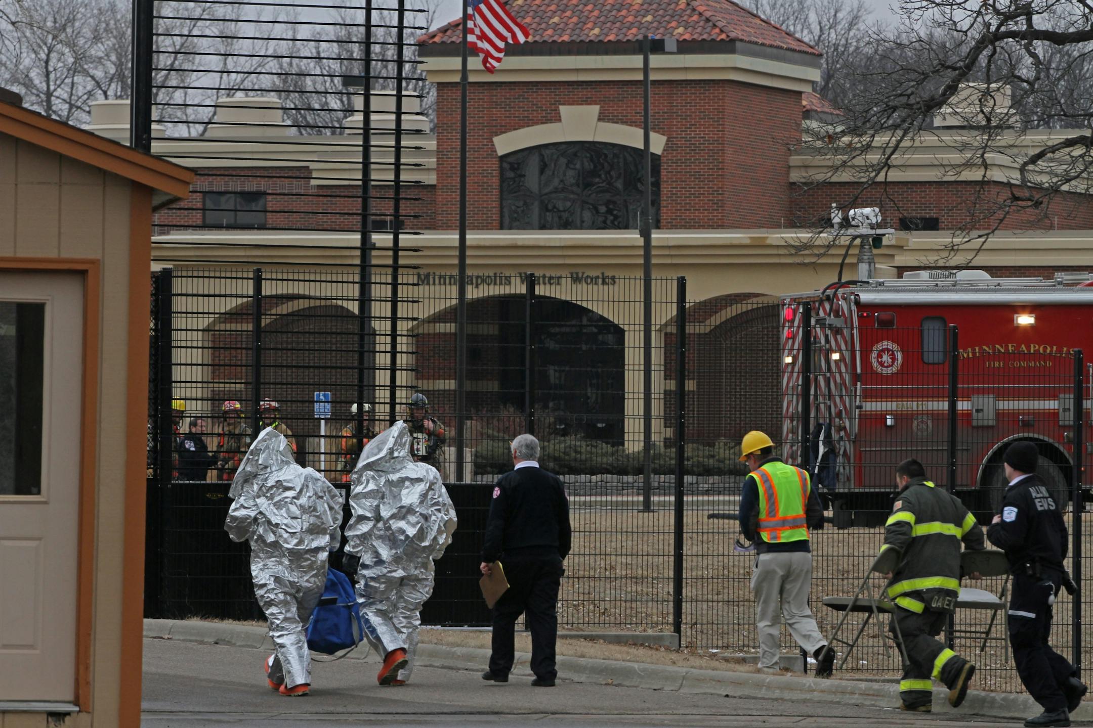 Minneapolis Fire Department hazmat teams walked to the entrance of the Minneapolis Water Works Building in Columbia Height to do an inspection of the building after two chemicals were accidently mixed together, setting off an alarm. There were no injuries due to the chemical alarm at the plant. Minneapolis, St. Anthony Falls and Columbia Heights fire departments responded to the alarm Tuesday afternoon on 2/14/12.