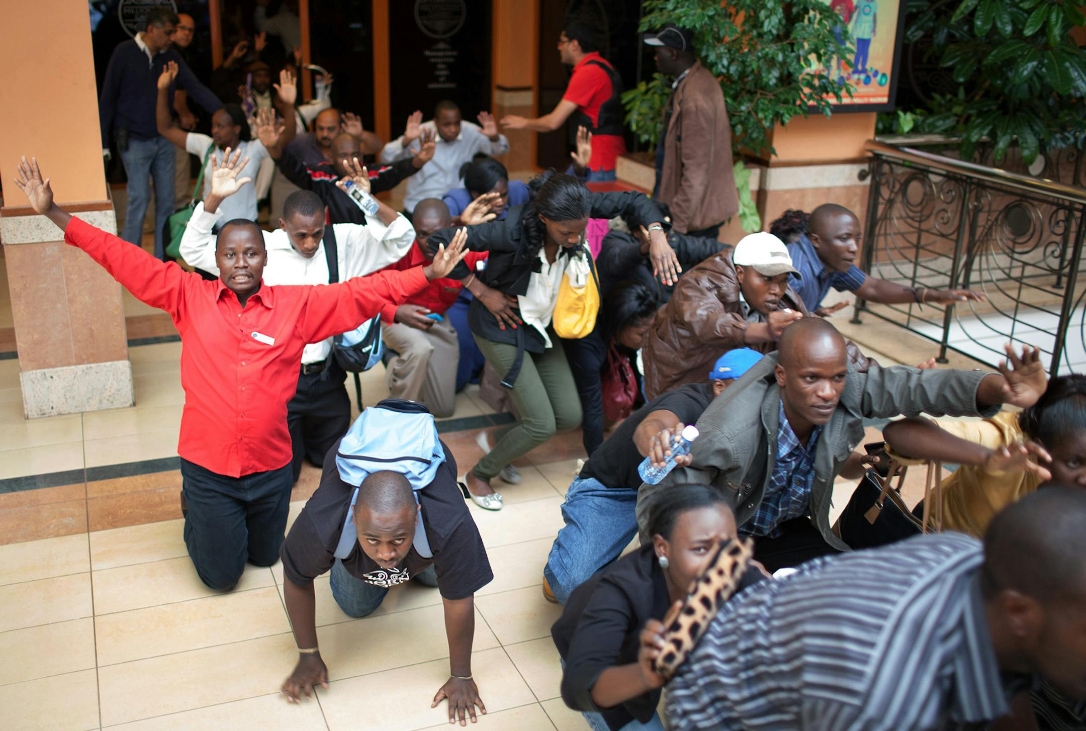 Shoppers evacuated the Westgate mall while authorities search for gunmen on Saturday in Nairobi, Kenya. Al-Shabab, a militant Islamist group in Somalia, claimed responsibility for an attack that killed dozens at the mall.