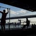 FILE -- People exercise at a public park along the East River on Manhattan's Lower East Side, June 10, 2015. A new analysis of data from more than 55,