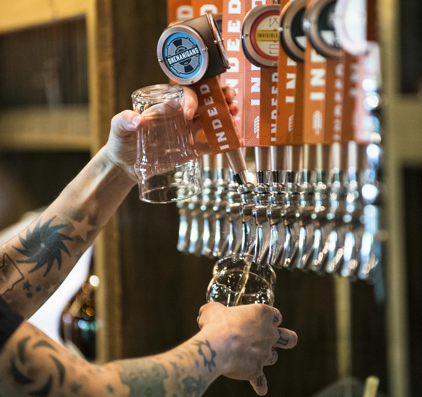 Heather Kraft poured beer for customers Wednesday afternoon. ] (AARON LAVINSKY/STAR TRIBUNE) aaron.lavinsky@startribune.com As the craft beer market continues to grow in Minnesota and nationwide, analysts and insiders wonder if it's a Renaissance or a bubble. For now, brewers and customers are showing no signs of a slowdown. We photograph day-to-day operations at Indeed Brewery and the bar at New Bohemia on Wednesday, May 25, 2016 in Minneapolis.