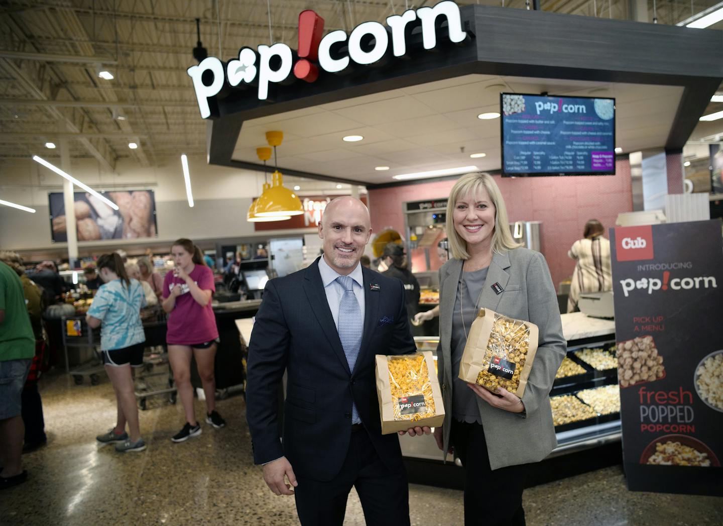 Chad Ferguson, president of Cub's retail west division and Anne Dament, senior vice president of retail, merchandise and marketing, proudly stood in front of the new popcorn stand in the Stillwater Cub.] Richard Tsong-Taatarii/Richard.tsong-taatarii@startribune.com