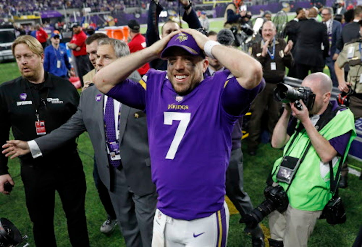 Minnesota Vikings quarterback Case Keenum (7) celebrates following a 29-24 win over the New Orleans Saints in an NFL divisional football playoff game in Minneapolis, Sunday, Jan. 14, 2018. (AP Photo/Charlie Neibergall) ORG XMIT: MNMC152