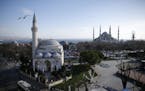A view of the Sultan Ahmed Mosque, right, better known as the Blue Mosque in the historic Sultanahmet district of Istanbul, the area of an explosion o