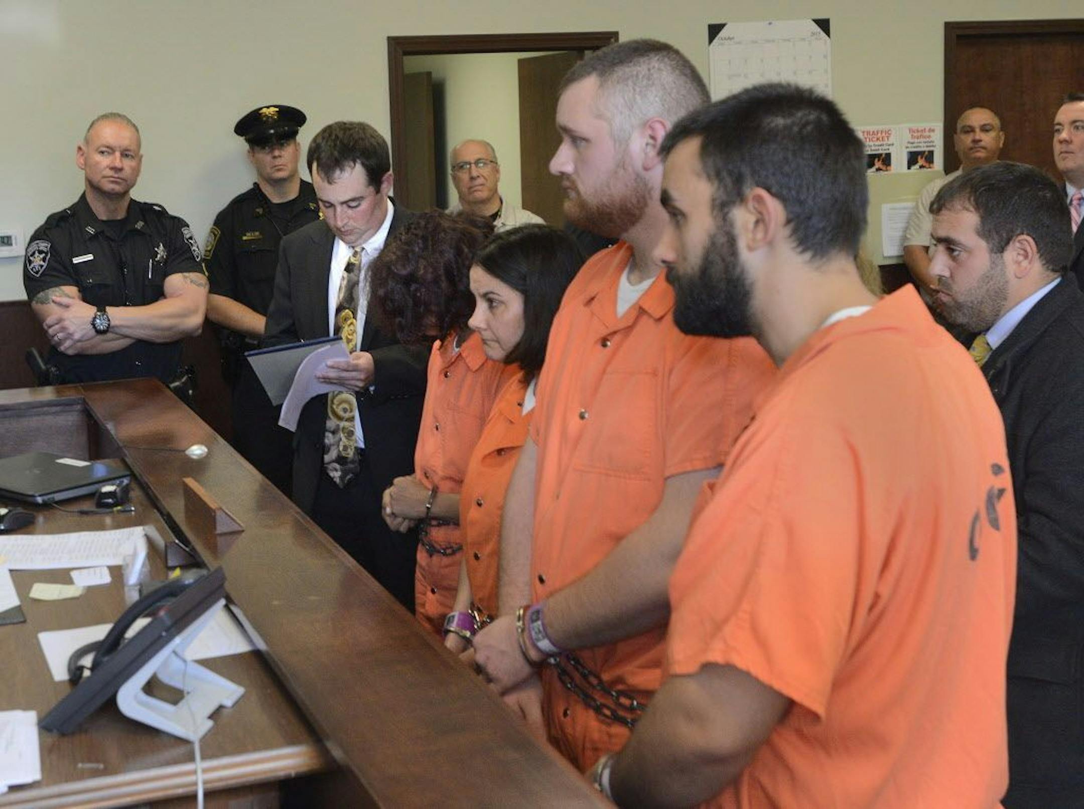 From left, Sarah Ferguson, 33, Linda Morey, 54, Joseph Irwin, 26, and David Morey, 26, are arraigned in front of Judge Bill M. Virkler after being charged with second-degree assault of 17-year-old Christopher T. Leonard, Teusday, Oct. 13, 2015 in New Hartford, N.Y.