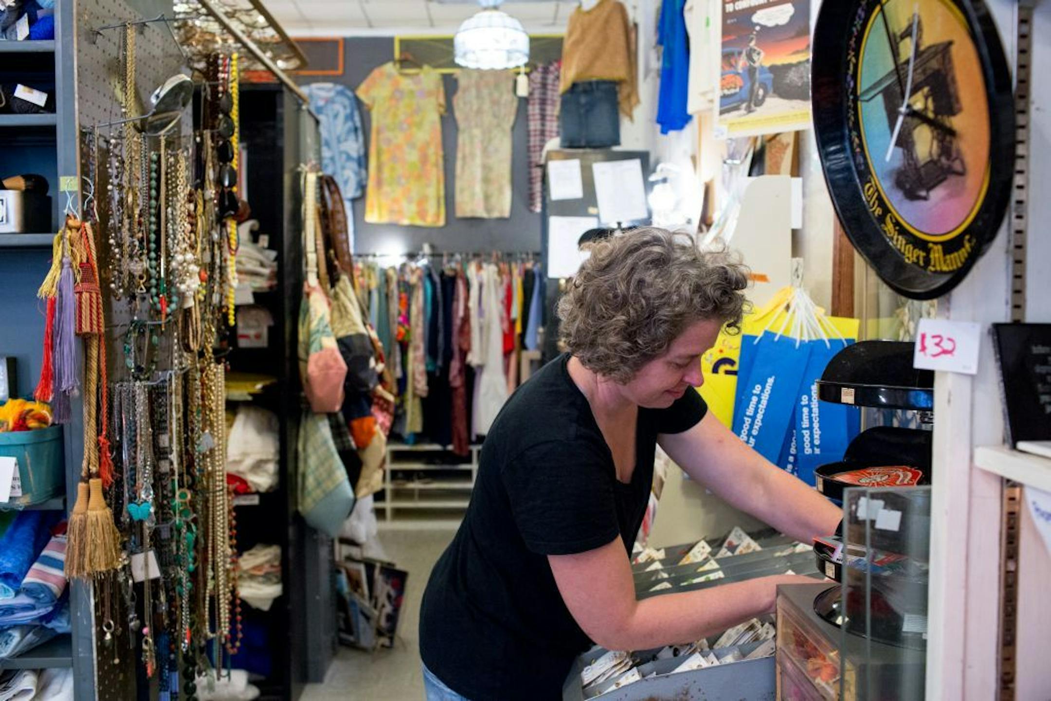 Julie Kearns organizes buttons in her store, Junket: Tossed & Found.