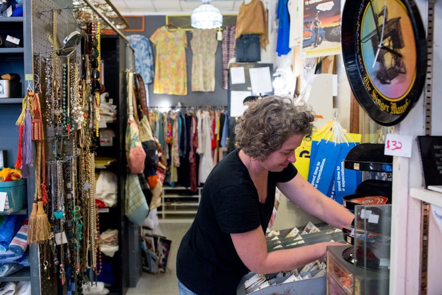 Julie Kearns organizes buttons in her store, Junket: Tossed & Found.