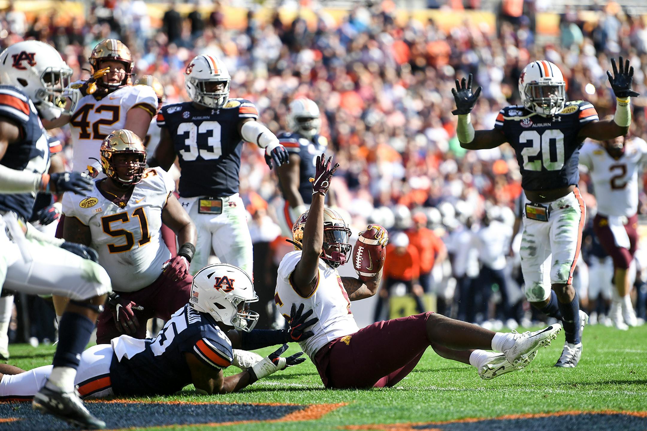 Minnesota Gophers wide receiver Tyler Johnson (6) signaled for a touchdown, but it was ruled short of the goal line against the Auburn Tigers in the second quarter.