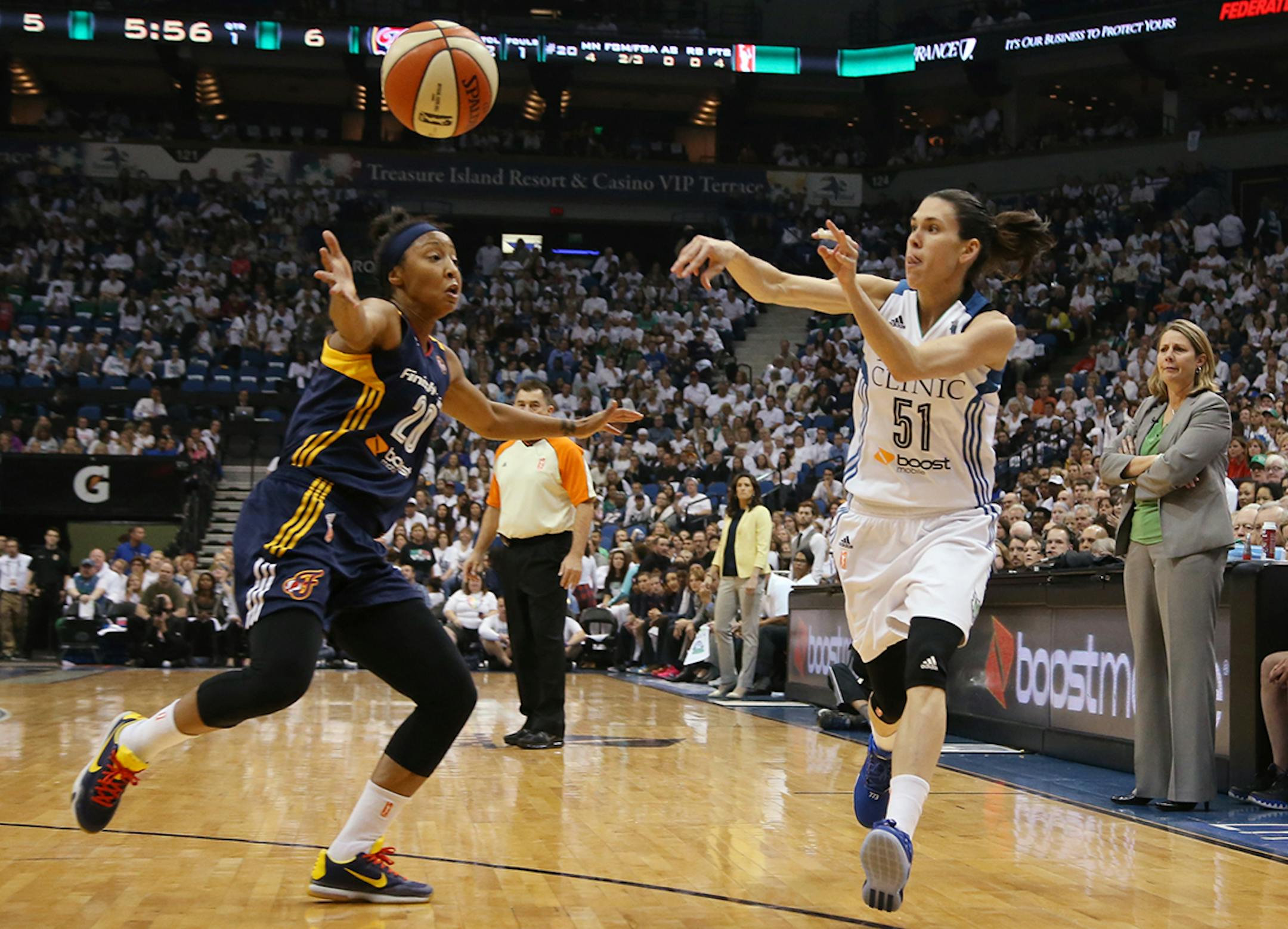 Minnesota Lynx guard Anna Cruz (51) passes the ball past Indiana Fever guard Briann January (20) during the first half.