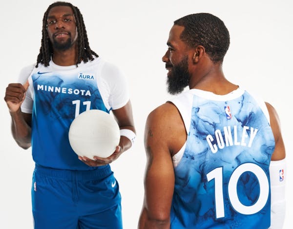 Naz Reid and Mike Conley modeled the Wolves’ new City Edition jerseys.