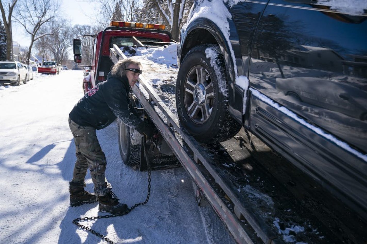 Kerry Brendmoen of Corky's Towing towed a car during a snow emergency in Minneapolis.