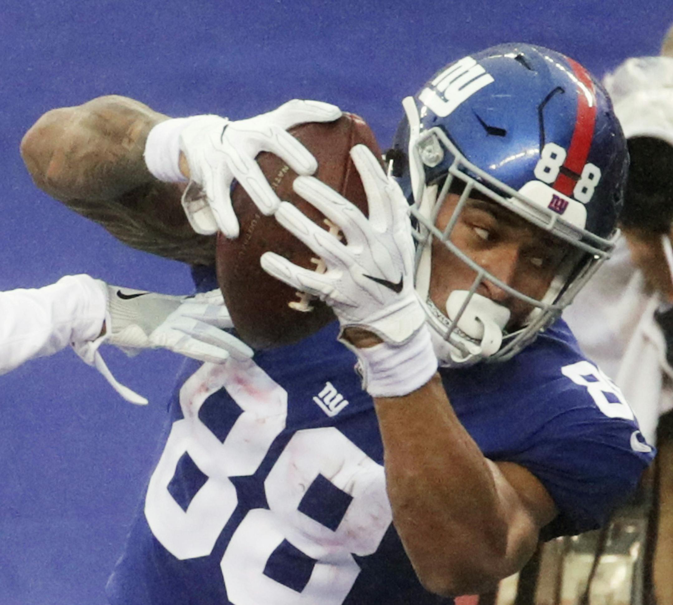 New York Giants' Evan Engram (88) catches a pass for a touchdown while defended by Los Angeles Rams' Dominique Hatfield (36) during the second half of an NFL football game Sunday, Nov. 5, 2017, in East Rutherford, N.J. (AP Photo/Julio Cortez)
