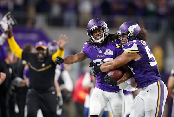 Minnesota Vikings cornerback Trae Waynes (26) celebrated his interception against the Packers late in the forth quarter with linebacker Eric Kendricks