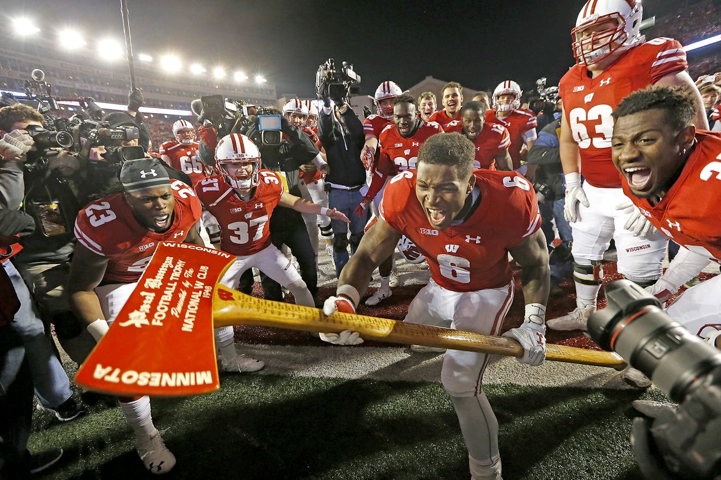 Wisconsin's running back Corey Clement took the Paul Bunyan's Axe to the goal post after Wisconsin defeated Minnesota 31-17 at Camp Randall Stadium, Saturday, November 26, 2016 in Madison, Wis.