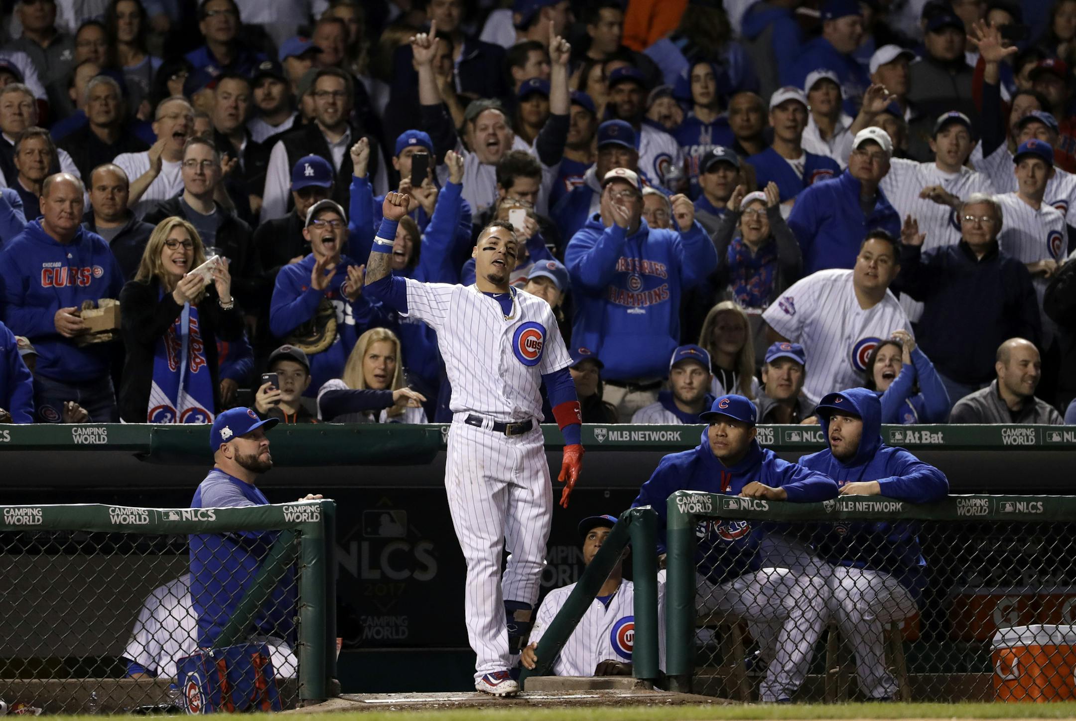 Chicago Cubs' Javier Baez celebrates after hitting his second home run during the fifth inning of Game 4 of baseball's National League Championship Series against the Los Angeles Dodgers, Wednesday, Oct. 18, 2017, in Chicago. (AP Photo/Matt Slocum)