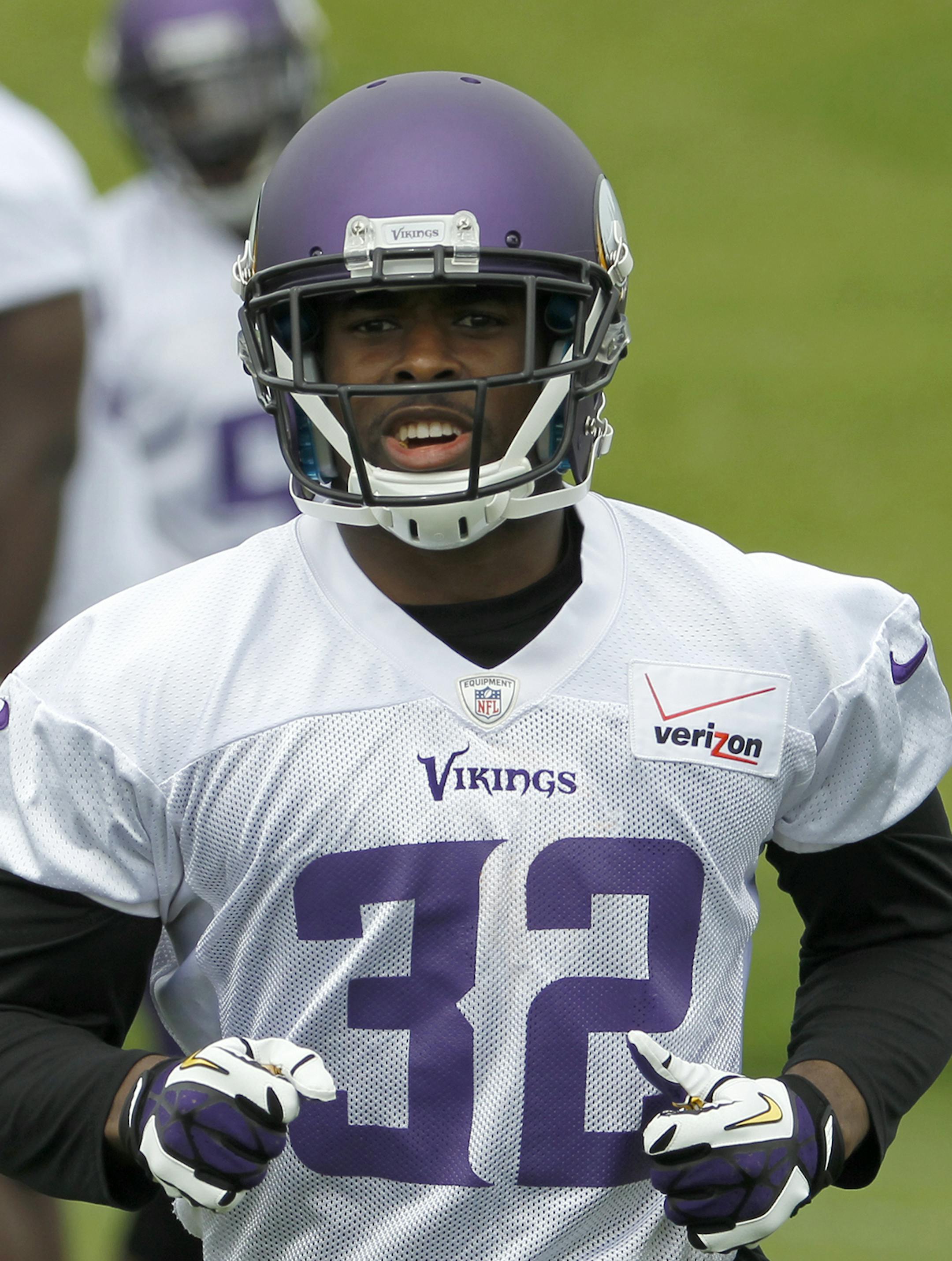 Minnesota Vikings free safety Antone Exum (32) runs during an NFL organized training activity in Eden Prairie, Minn., Wednesday, June 11, 2014. (AP Photo/Ann Heisenfelt) ORG XMIT: OTKAH114